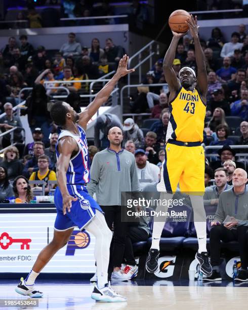 Pascal Siakam of the Indiana Pacers attempts a shot while being guarded by Harrison Barnes of the Sacramento Kings in the third quarter at Gainbridge...