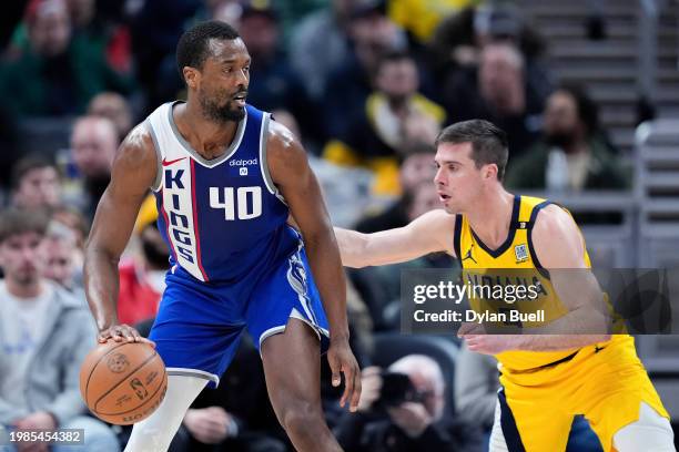 Harrison Barnes of the Sacramento Kings dribbles the ball while being guarded by T.J. McConnell of the Indiana Pacers in the third quarter at...