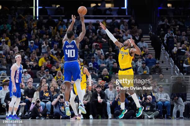 Harrison Barnes of the Sacramento Kings attempts a shot while being guarded by Buddy Hield of the Indiana Pacers in the fourth quarter at Gainbridge...