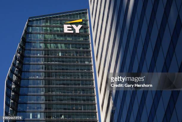 The corportate logo for Ernst & Young Global Limited sits at the top of their office building on February 3 in Toronto, Canada..
