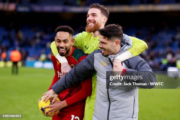 Pedro Neto of Wolverhampton Wanderers presents Matheus Cunha with the match ball after he scored a hat trick during the Premier League match between...