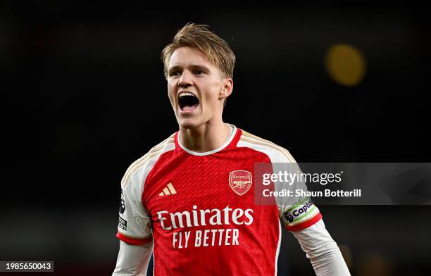 Martin Odegaard of Arsenal celebrates after the team's victory in the Premier League match between Arsenal FC and Liverpool FC at Emirates Stadium on...