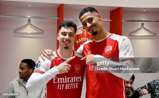 Gabriel Martinelli and William Saliba of Arsenal pose for a photo in the Arsenal dressing room after the team's victory in the Premier League match...