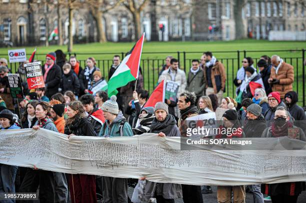 Pro Palestine protesters hold a banner outside Bute House after the march. Pro Palestine supporters held a rally in Edinburgh at The Mound where the...