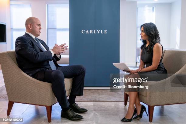 Harvey Schwartz, chief executive officer of Caryle Group Inc., left, during a Bloomberg Television interview in Washington, DC, US, on Wednesday,...