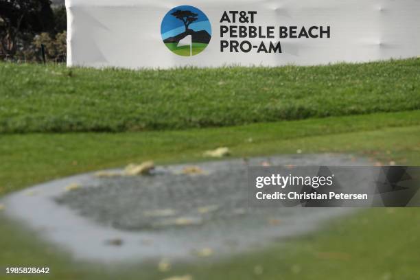 Water puddles are seen on course greens during the delayed final round start the AT&T Pebble Beach Pro-Am at Pebble Beach Golf Links on February 04,...