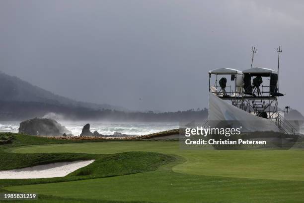High winds blow against course television towers during the delayed final round start the AT&T Pebble Beach Pro-Am at Pebble Beach Golf Links on...