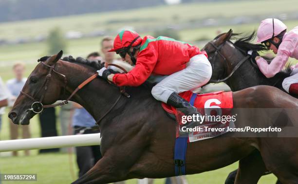 Irish Jockey Kieren Fallon riding Hurricane Run winning the Irish Derby at The Curragh, 26th June 2005. Placed second Irish Jockey Colm O'Donoghue...