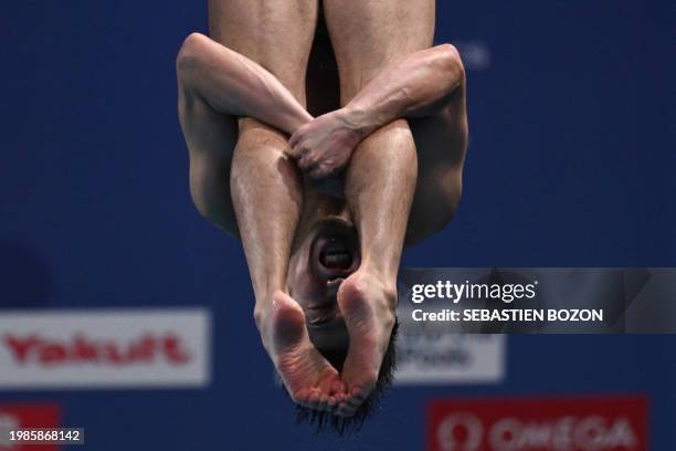 Japan's Sho Sakai competes in the final of the men's 3m springboard diving event during the 2024 World Aquatics Championships at Hamad Aquatics...