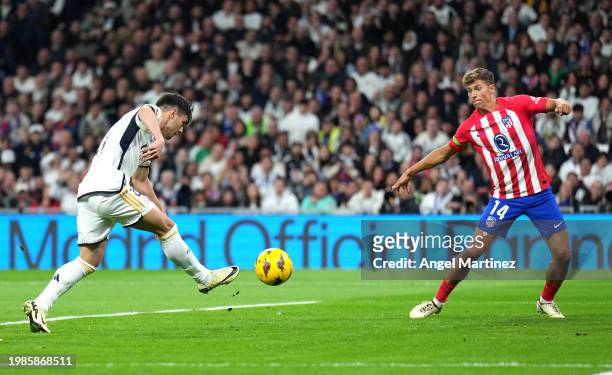 Brahim Diaz of Real Madrid scores his team's first goal during the LaLiga EA Sports match between Real Madrid CF and Atletico Madrid at Estadio...