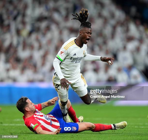 Eduardo Camavinga of Real Madrid is tackled by Saul Niguez of Atletico Madrid during the LaLiga EA Sports match between Real Madrid CF and Atletico...