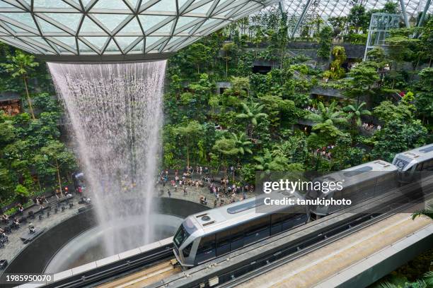 rain vortex in singapore - singapore airport stock pictures, royalty-free photos & images