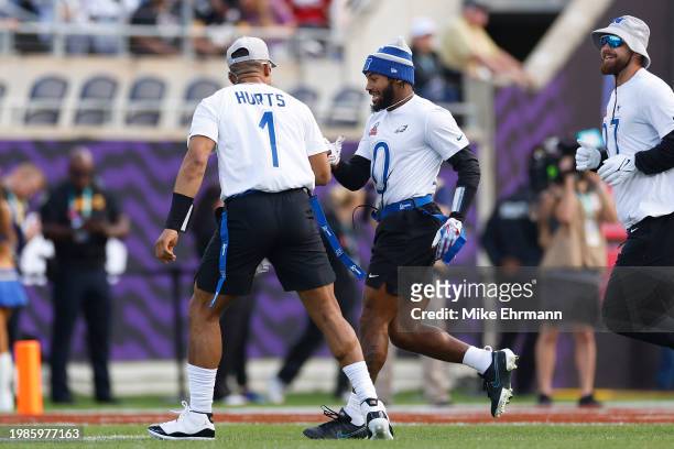 Andre Swift of the Philadelphia Eagles and Jalen Hurts of the Philadelphia Eagles and NFC reacts during the first quarter of the 2024 NFL Pro Bowl...