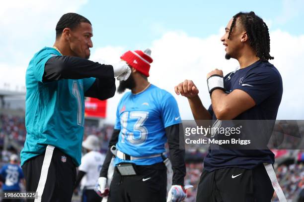 Evan Engram of the Jacksonville Jaguars celebrates with C.J. Stroud of the Houston Texans and AFC during the first half of the 2024 NFL Pro Bowl...