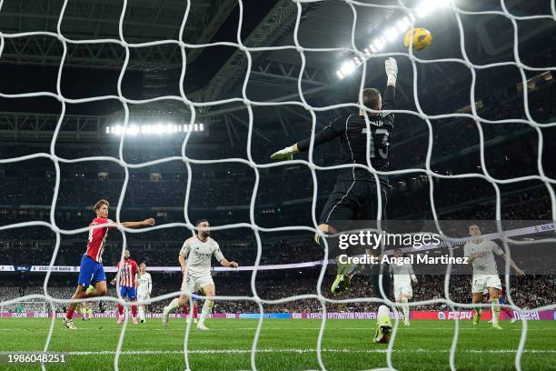 Marcos Llorente of Atletico Madrid scores his team's first goal during the LaLiga EA Sports match between Real Madrid CF and Atletico Madrid at...