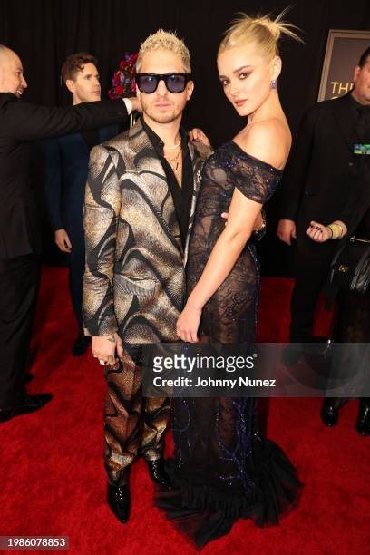 Andrew Watt and Charlotte Lawrence attend the 66th GRAMMY Awards at Crypto.com Arena on February 04, 2024 in Los Angeles, California.