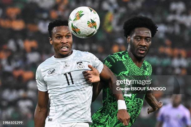 South Africa's forward Themba Zwane fights for the ball with Nigeria's defender Ola Aina during the Africa Cup of Nations 2024 semi-final football...