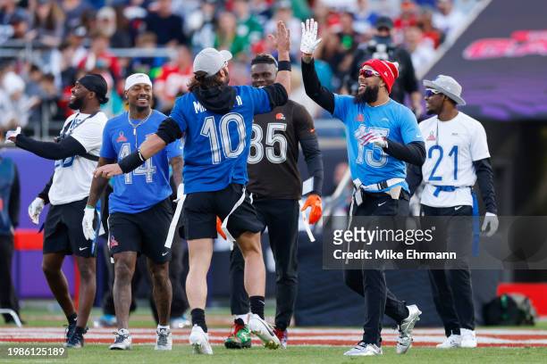 Keenan Allen of the Los Angeles Chargers and AFC celebrates with Gardner Minshew of the Indianapolis Colts after catching a pass for a touchdown...
