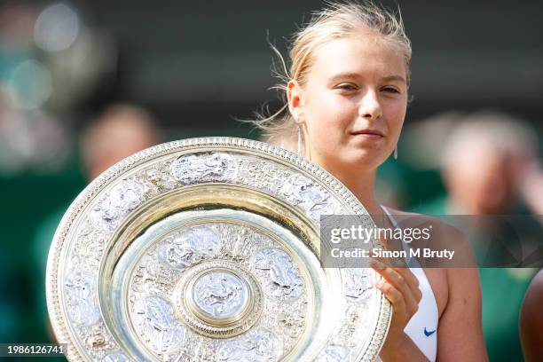 Maria Sharapova of Russia with the winners trophy after beating Serena Williams of the USA in the Ladies Single Final at The Wimbledon Lawn Tennis...