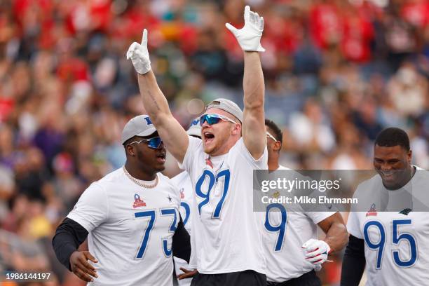 Aidan Hutchinson of the Detroit Lions and NFC celebrates with teammates after winning a tug-of-war challenge during the 2024 NFL Pro Bowl Games at...