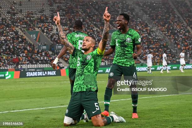 Nigeria's defender William Troost-Ekong celebrates after scoring his team's first goal from the penalty spot during the Africa Cup of Nations 2024...