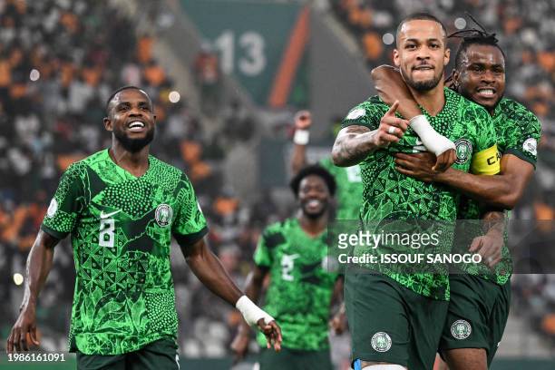 Nigeria's defender William Troost-Ekong celebrates with teammates after scoring his team's first goal from the penalty spot during the Africa Cup of...