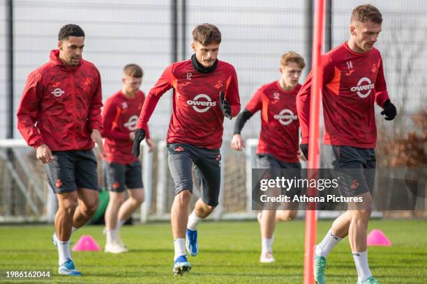 Ben Cabango , Jamie Paterson and Josh Tymon warm up during the Swansea City Training Session at The Fairwood Training Ground on February 07, 2024 in...