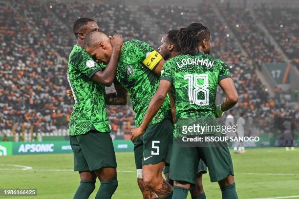 Nigeria's defender William Troost-Ekong celebrates with teammates after scoring his team's first goal from the penalty spot during the Africa Cup of...