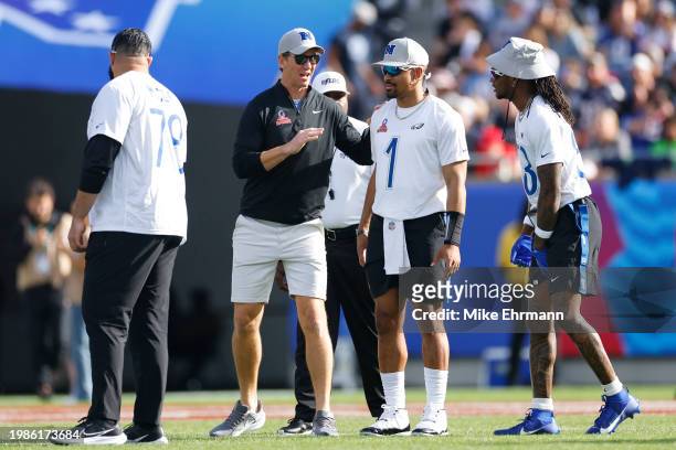 Head coach Eli Manning of the NFC talks with Jalen Hurts of the Philadelphia Eagles and NFC during the first half of the 2024 NFL Pro Bowl Games at...
