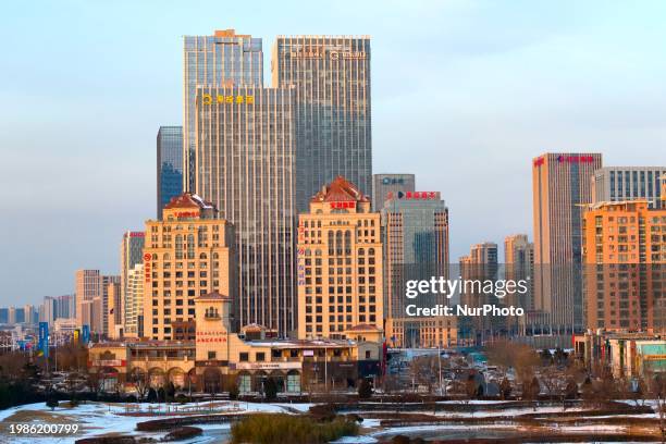 Snow is covering the scenery in the West Coast New Area of Qingdao, Shandong province, China, on February 6, 2024. The West Coast New Area's total...