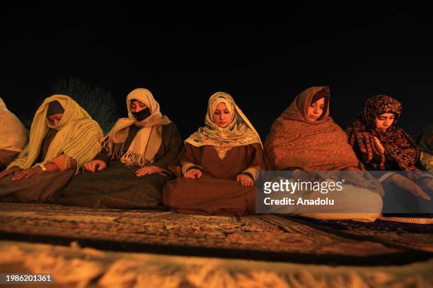 Women perform night prayers at the Hazratbal shrine on the occasion of Lailat al Miraj or Shab-e-Meraj in India-administered state of Jammu and...
