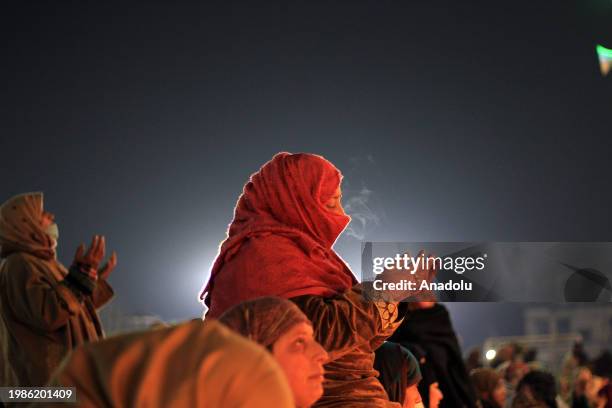 Woman supplicates at the Hazratbal shrine on the occasion of Lailat al Miraj or Shab-e-Meraj in India-administered state of Jammu and Kashmir on...