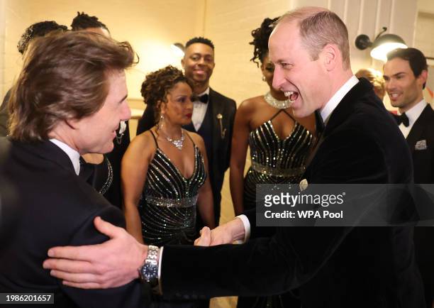 Prince William, Prince Of Wales speaks to Tom Cruise as he attends London's Air Ambulance Charity Gala Dinner at The OWO on February 7, 2024 in...