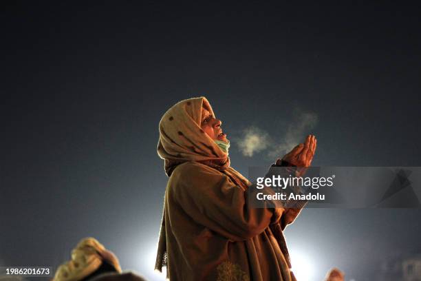 Woman supplicates at the Hazratbal shrine on the occasion of Lailat al Miraj or Shab-e-Meraj in India-administered state of Jammu and Kashmir on...