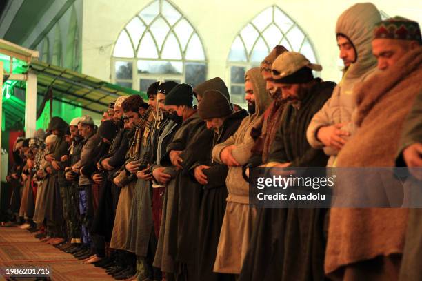 Men perform night prayers at the Hazratbal shrine on the occasion of Lailat al Miraj or Shab-e-Meraj in India-administered state of Jammu and Kashmir...