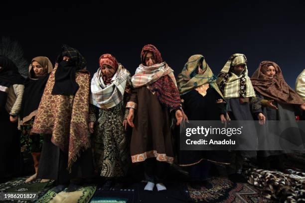 Women perform night prayers at the Hazratbal shrine on the occasion of Lailat al Miraj or Shab-e-Meraj in India-administered state of Jammu and...