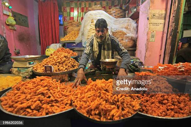 Man sells snacks and pudding outside the Hazratbal shrine on the occasion of Lailat al Miraj or Shab-e-Meraj in India-administered state of Jammu and...