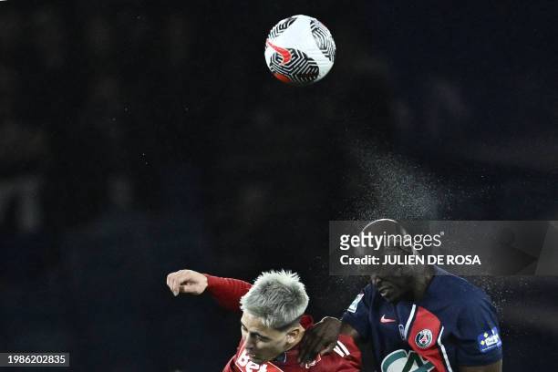 Paris Saint-Germain's Portuguese midfielder Danilo Pereira fights for the ball with Brest's Uruguayan forward Martin Satriano during the French Cup...
