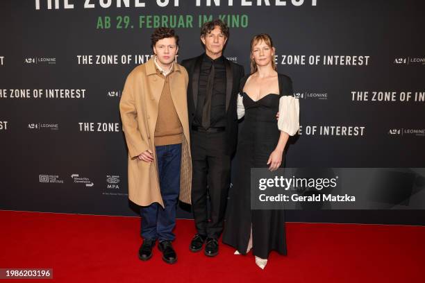 Christian Friedel, Jonathan Glazer and Sandra Hüller attend the Berlin premiere of "The Zone Of Interest" at Delphi Filmpalast on February 7, 2024 in...