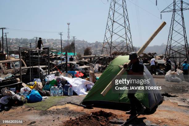 Residents camp on the land where their houses were destroyed after a forest fire in the Poblacion Monte Sinai neighborhood in Viña Del Mar, Chile, on...