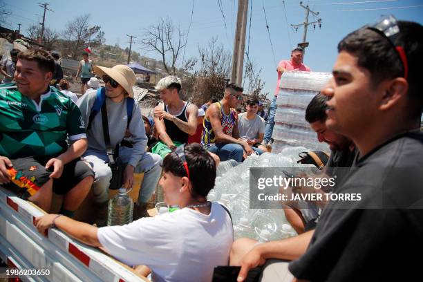 Volunteers deliver community aid to affected residents after a forest fire in the Poblacion Monte Sinai neighborhood in Viña Del Mar, Chile, on...