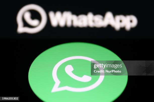 WhatsApp logo displayed on a laptop screen and WhatsApp logo displayed on a phone screen are seen in this illustration photo taken in Krakow, Poland...