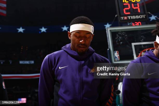 Bradley Beal of the Phoenix Suns stands for the National Anthem before the game against his former team the Washington Wizards on February 4, 2024 at...