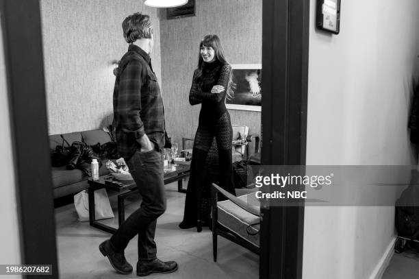 Episode 1482 -- Pictured: Host Seth Meyers talks with actress Dakota Johnson backstage on February 7, 2024 --