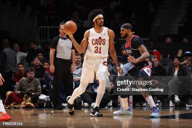 Jarrett Allen of the Cleveland Cavaliers handles the ball against Daniel Gafford of the Washington Wizards during the game on February 7, 2024 at...