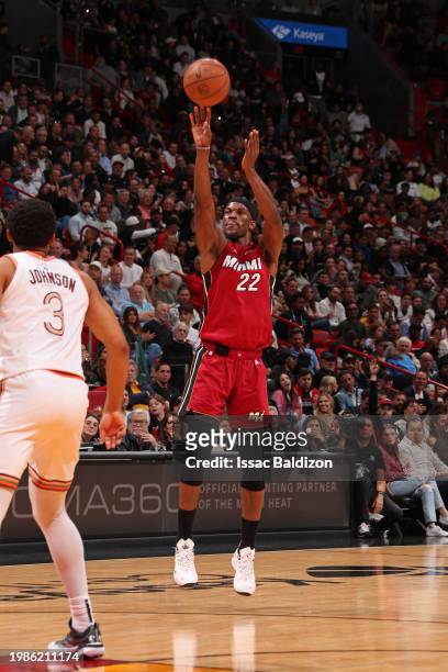 Jimmy Butler of the Miami Heat shoots a three point basket during the game against the San Antonio Spurs on February 7, 2024 at Kaseya Center in...
