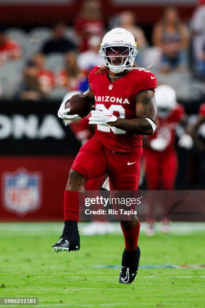 Corey Clement of the Arizona Cardinals runs with the ball during a game against the Kansas City Chiefs at State Farm Stadium on August 19, 2023 in...