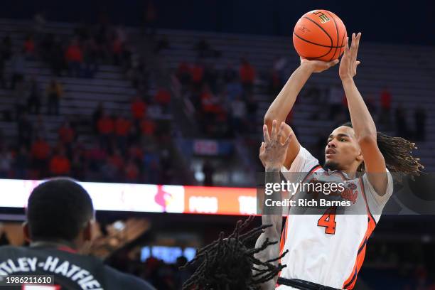 Chris Bell of the Syracuse Orange shoots the ball against the Louisville Cardinals during the second half at the JMA Wireless Dome on February 7,...