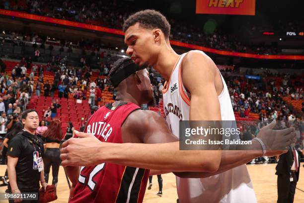 Jimmy Butler of the Miami Heat and Victor Wembanyama of the San Antonio Spurs embrace after the game on February 7, 2024 at Kaseya Center in Miami,...