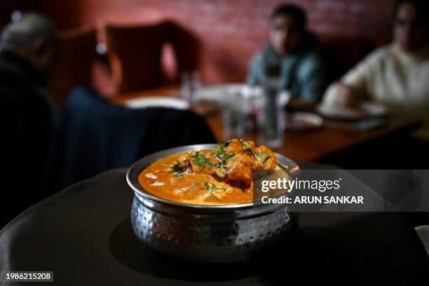 This photograph taken on January 29 shows a butter chicken dish served at the Moti Mahal restaurant in New Delhi. Butter chicken, one of India's most...